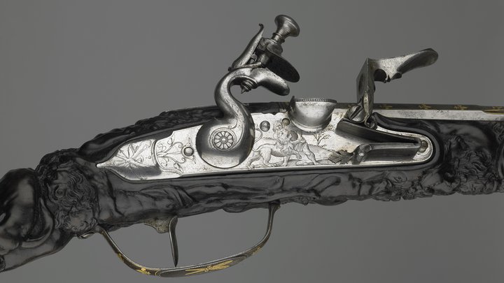 A detail of the firing mechanism of a flint-lock pistol