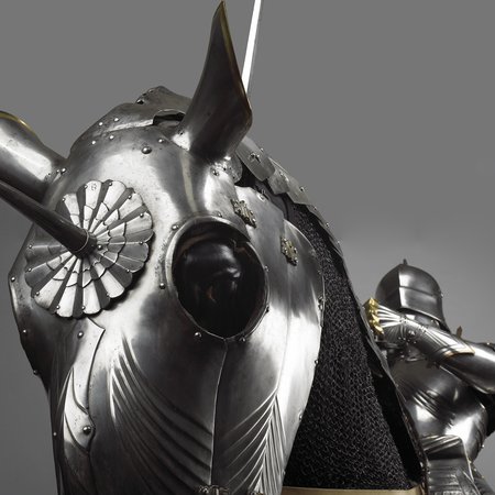 Close up detail photograph of a medieval knight on an armoured horse