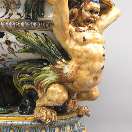 Detail of ceramic monster supporting basin of wine cooler