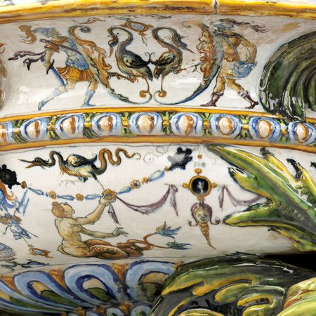 Detail of side of wine cooler with monsters and roman battle scenes depicted