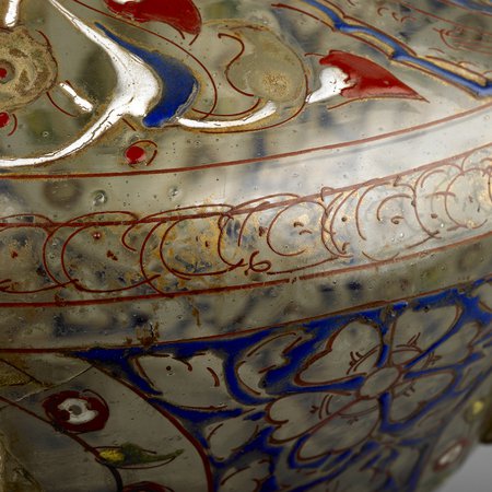 Detail of glass lamp with blue and gold illustrations of flowers