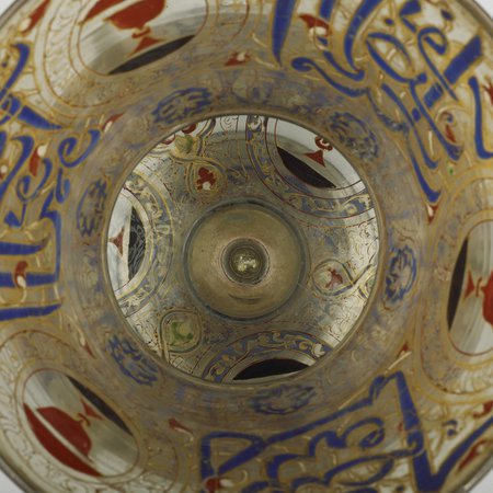Birdseye view of glass lamp with blue and gold illustrations
