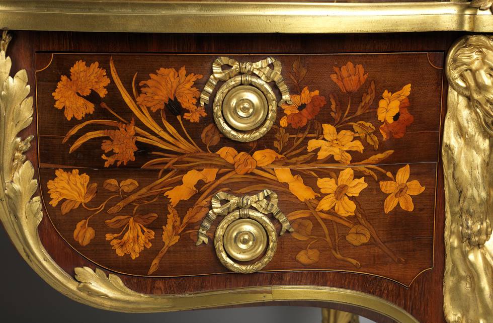 A detail of floral marquetry on a roll-top desk