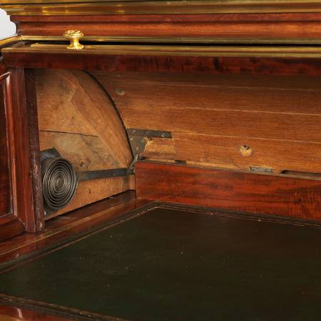 A detail of the inside of a mahogany-veneered cylinder desk, with inner cabinet removed