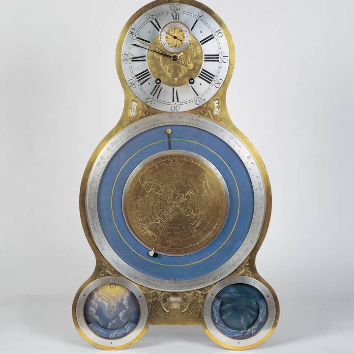 Gold and blue clock face with four dials