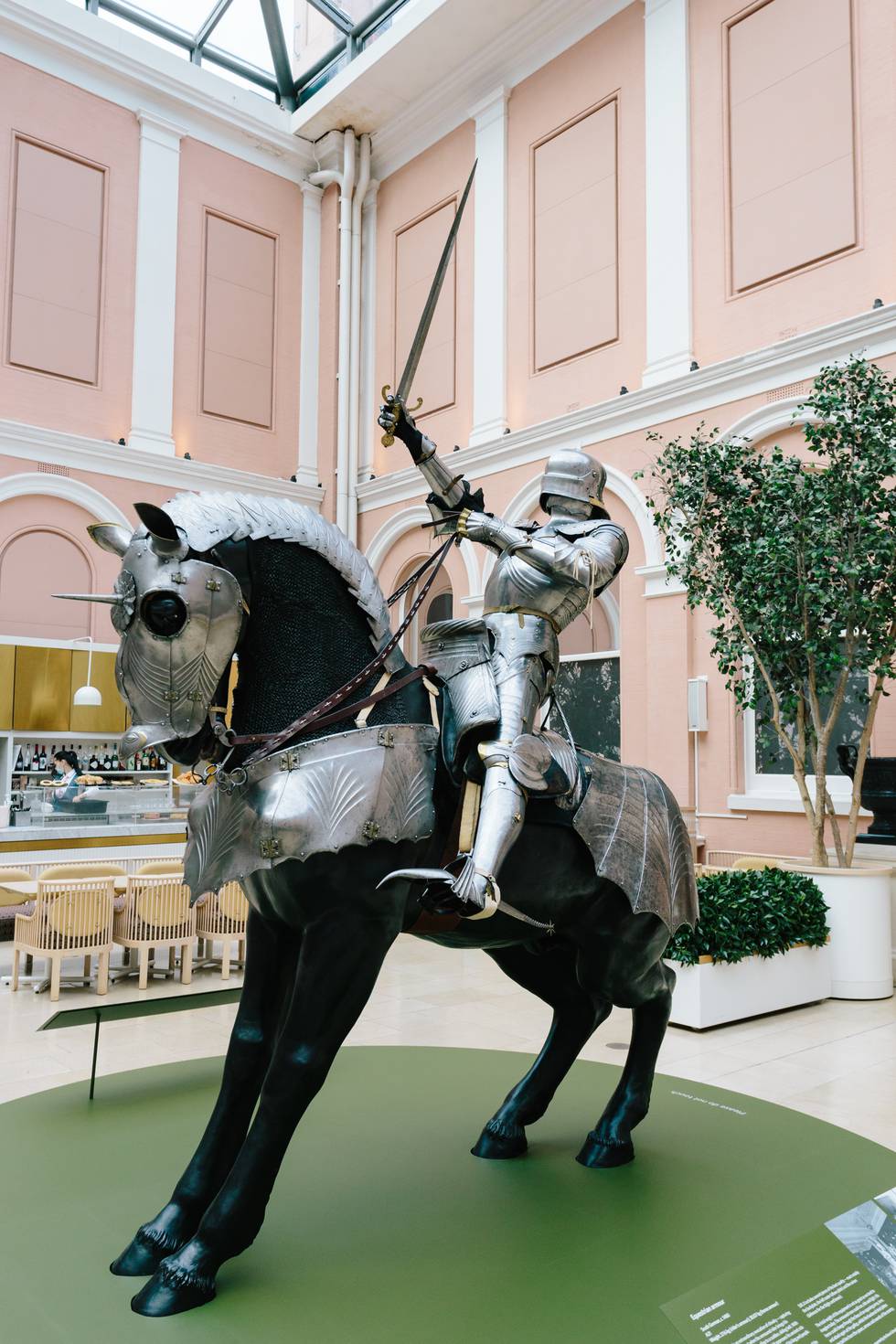 Full length photograph of a medieval knight on an armoured horse