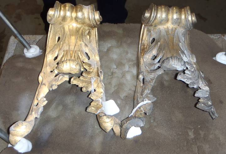 Two gilt-metal mounts from a chest of drawers (F406) after dry ice particle cleaning (left) and before (right).