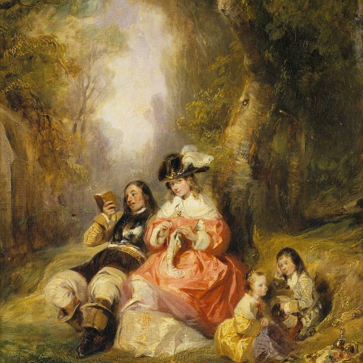 Family of four sitting in a sunny rural setting