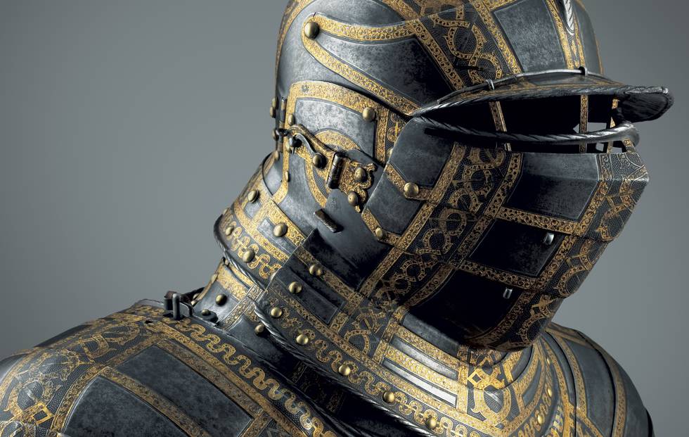 Photograph of a richly etched armour showing the shoulders and helm