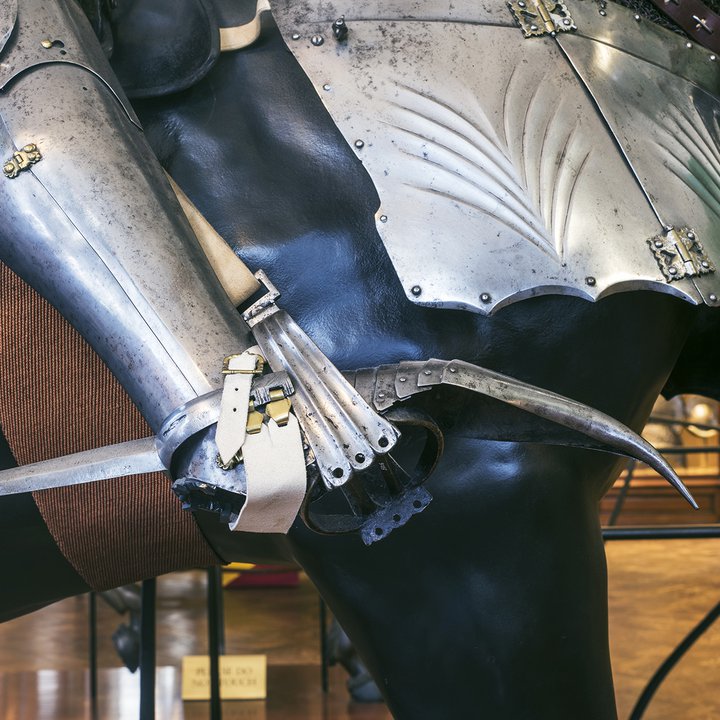 Detail of the foot of a model in armour on a model horse