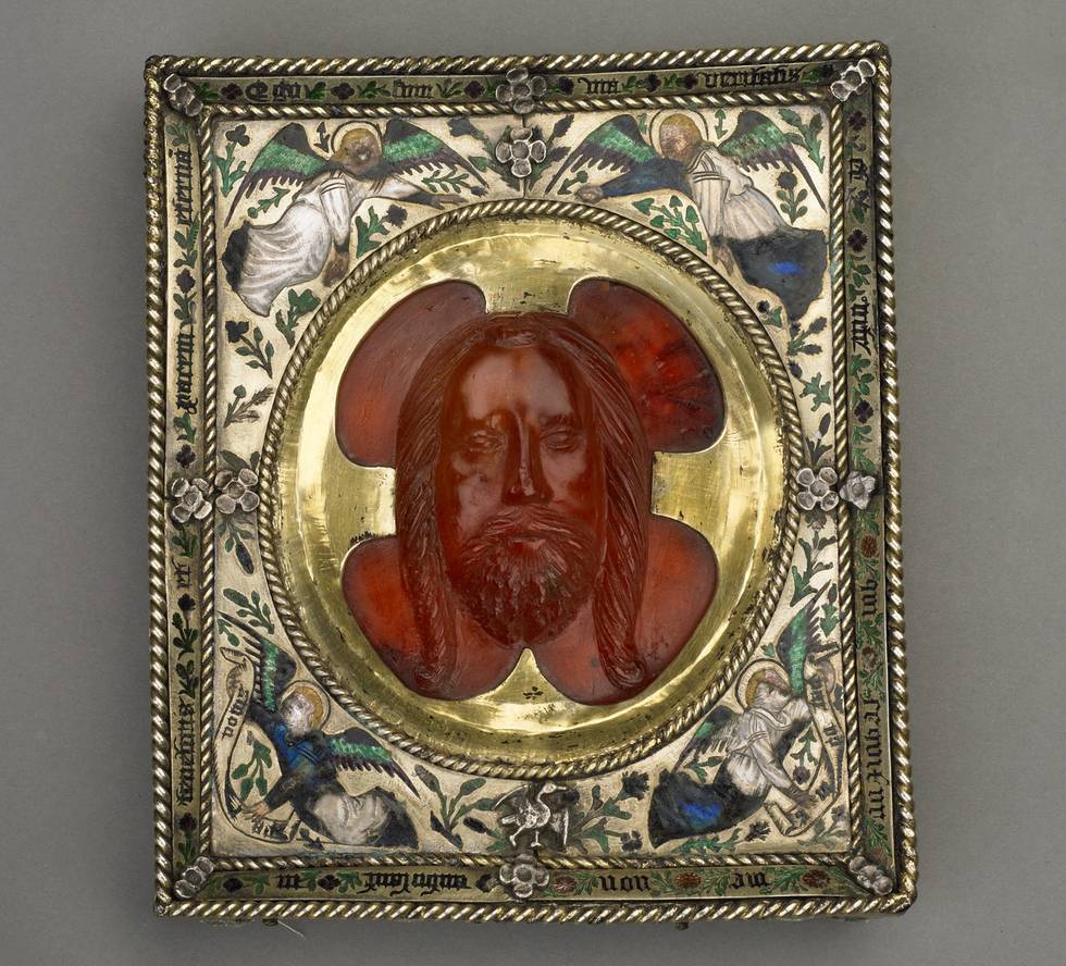 Head of Christ carved in amber on a square silver frame