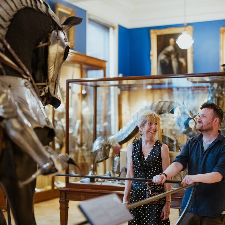 woman and man looking at armour